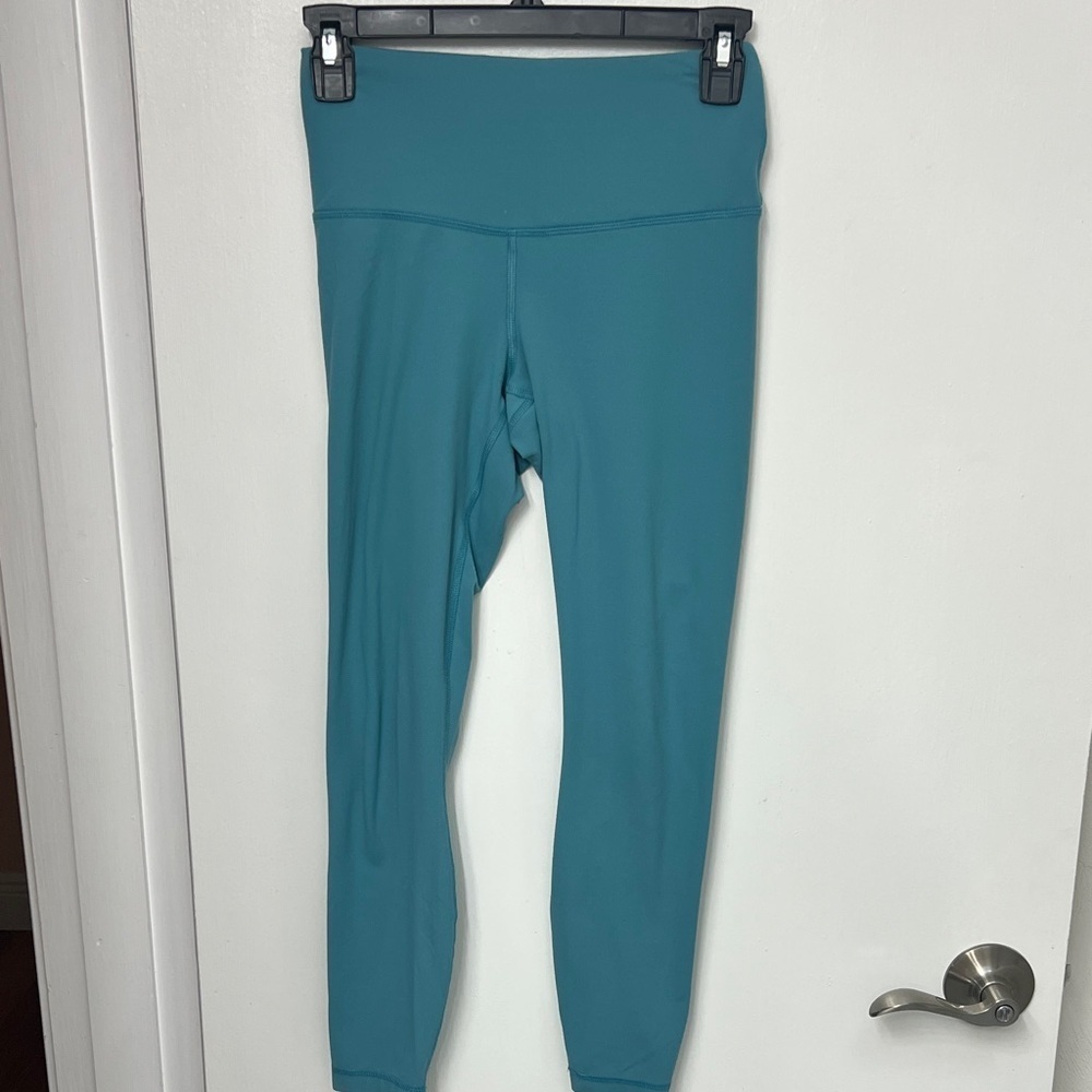 Yogalicious teal colored leggings Size XS, 24” inseam, 1 hidden pocket